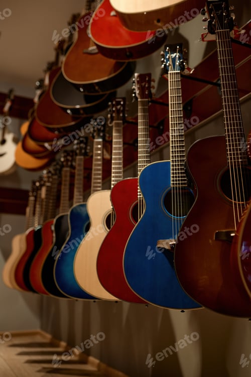 Preview: Selective focus on rack of guitar string instrument at music shop