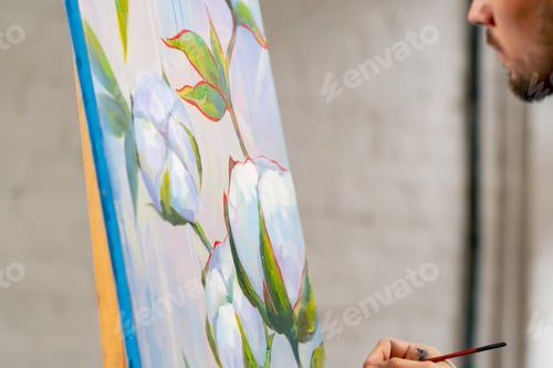 Preview: an art studio a painting with flowers the artist sitting the details on the painting with red paint