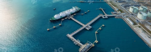 Preview: LNG (Liquified Natural Gas) tanker anchored in Gas terminal gas tanks for storage. Oil Crude Gas