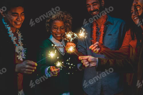 Preview: Happy diverse friends celebrating with sparklers on new year eve - Soft focus on african woman face