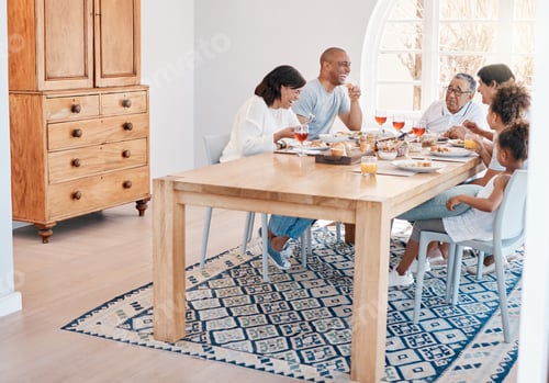 Preview: Deep belly laughs are so important. Shot of a family having lunch together.