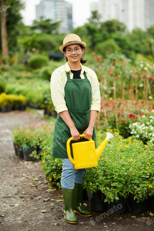 Preview: Young Woman Working at Flower Nursery