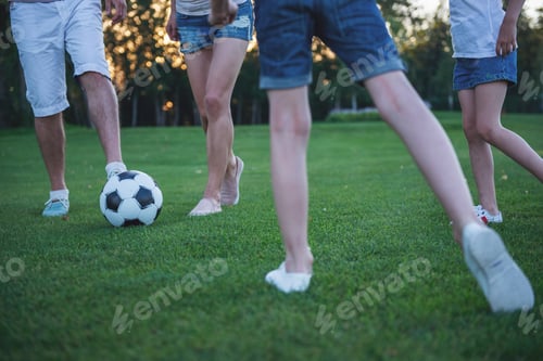 Preview: Family playing soccer