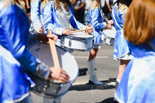 Preview: majorettes with white and blue uniforms perform in the streets of the city. photographic series