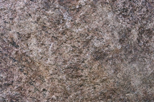 Preview: Large granite stone boulder texture background. Red granite old boulder with noise and grain in grun