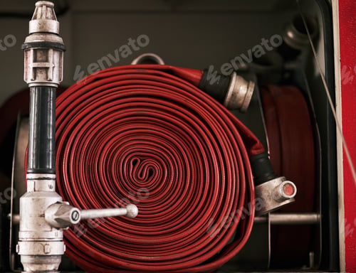 Preview: Behind the scenes at the fire station. Cropped shot of a coiled fire hose.