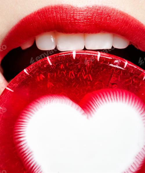 Preview: Face Part Portrait Of Beautiful Young Woman Tasting Red Lollipop With White Heart In The Middle