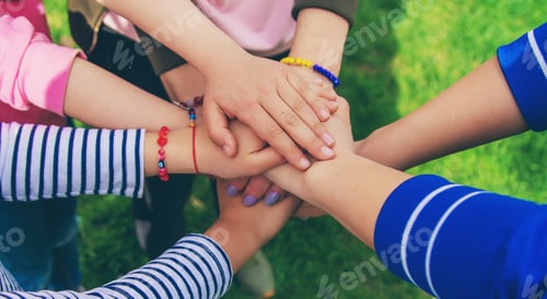 Preview: People put their hands together. Selective focus.