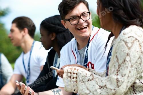 Preview: Male and female students on college campus reading smartphone texts
