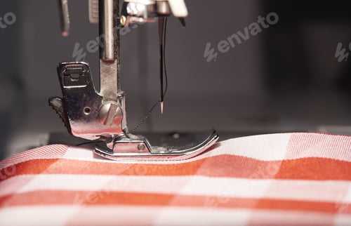 Preview: Closeup shot of a sewing machine with fabric