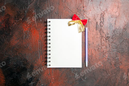 Preview: top view empty open notepad with pencil on a dark-brown background copybook photo xmas pen school