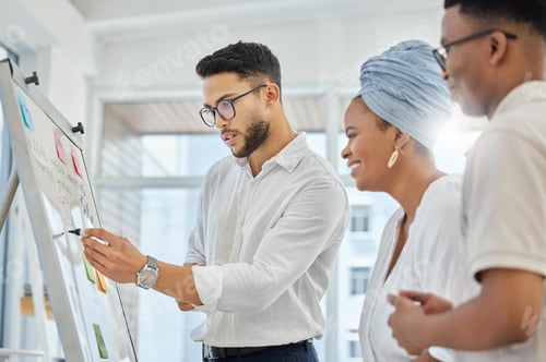 Preview: Cropped shot of a group of diverse young businesspeople working on a whiteboard in the boardroom