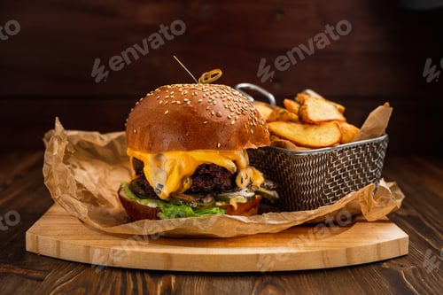Preview: Double cheeseburger with fried potatoes on wooden board