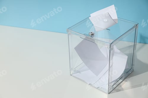 Preview: Voting box with papers on white table on blue background, space for text