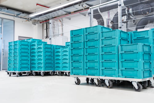 Preview: Turquoise colored containers inside modern factory warehouse, Stuttgart, Germany