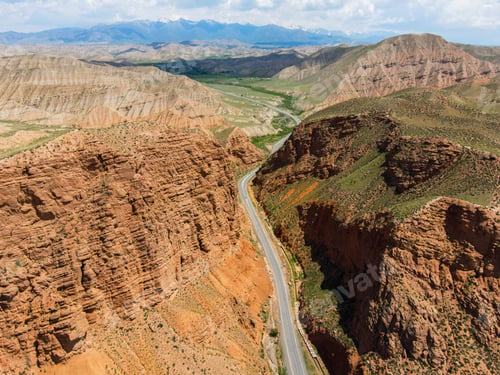 Preview: Winding road through a dramatic canyon landscape