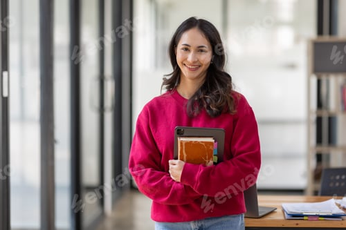 Preview: Image of young indian girl asian woman, company worker document file in hand, smiling and holding