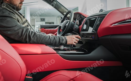 Preview: Car Buyer Checking on the Vehicle Luxurious Interior.