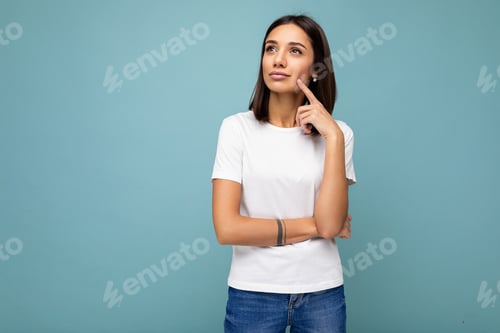 Preview: Portrait of positive thoughtful young attractive brunette woman with sincere emotions wearing casual