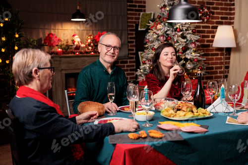 Preview: Old person at table on xmas with family