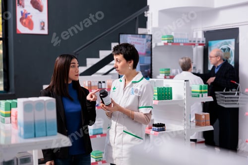 Preview: Customer returning vitamin bottle to pharmacist in drugstore