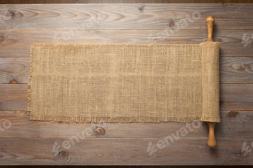 Preview: rolling pin and sacking burlap at wooden board