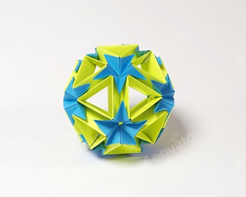 Preview: Origami ball made of pop colour paper on a white background