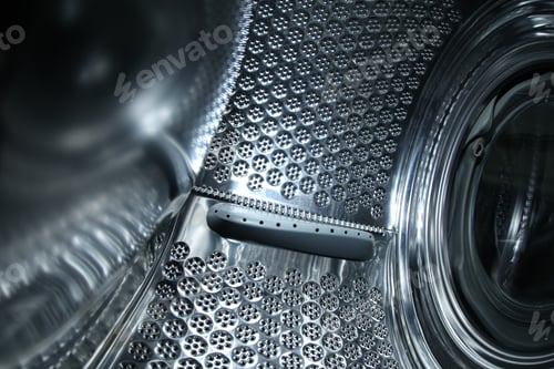 Preview: Empty washing machine drum, closeup view. Laundry day