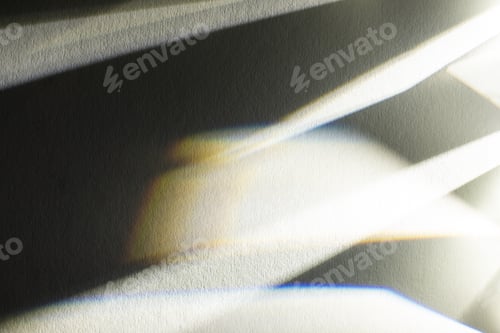 Preview: light prism with beams on dark textured background