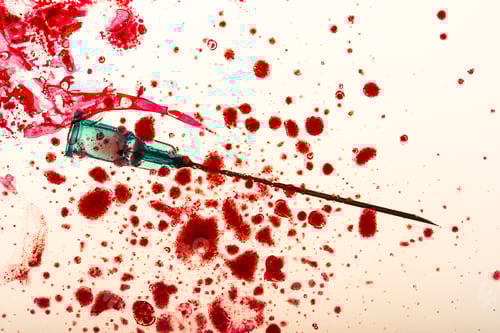 Preview: Studio shot of medical needle and blood drops