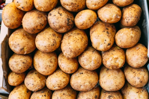 Preview: Potatoes forming background on farmers market