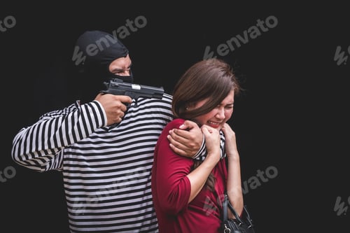 Preview: Thief threatening with gun, young woman scared and screaming while arrested by bandit.