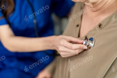 Preview: Close up of caregiver look after senior woman patient at nursing home.