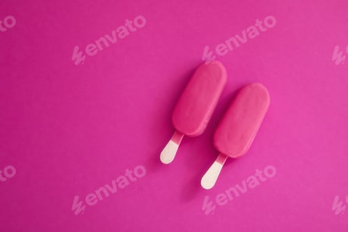 Preview: Pink strawberry flavor popsicles on the pink background.