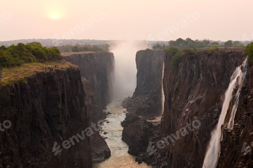 Preview: Victoria Falls, huge waterfalls of the Zambezi river flowing over sheer cliffs.