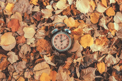 Preview: Daylight saving time concept, old analog alarm clock