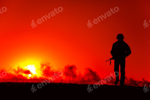 Preview: Army soldier walking on battlefield at sunset