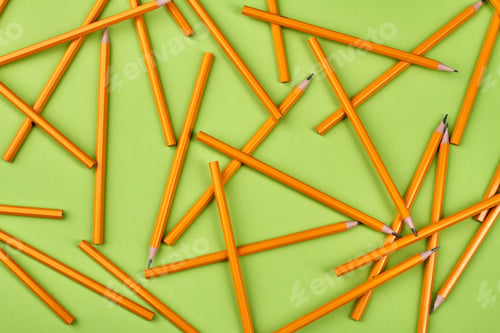 Preview: Yellow pencils on light-green background.