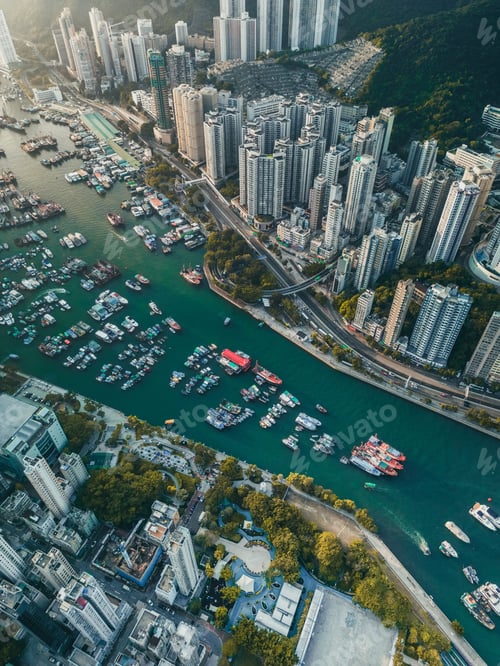 Preview: Aerial view of boats on the Aberdeen harbor near downtown buildings in Hong Kong