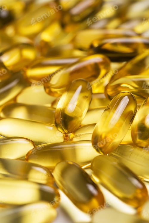 Preview: Close up of yellow fish or krill oil capsules