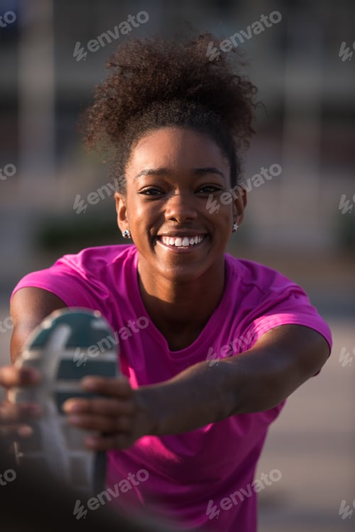Preview: African American woman doing warming up and stretching