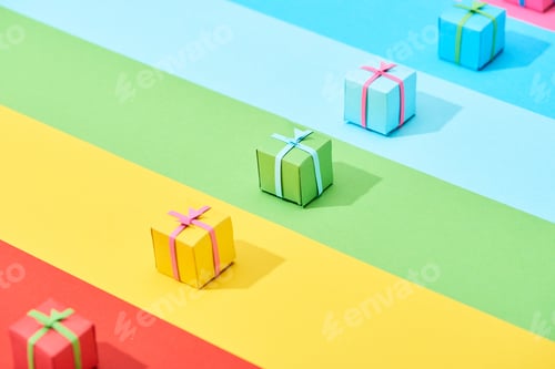 Preview: multicolored gift boxes on rainbow background