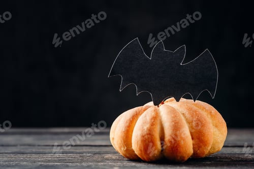 Preview: Homemade halloween cakes in the shape of pumpkin on dark background
