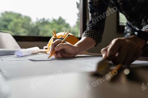Preview: Architect man working with blueprints for architectural plan, engineer sketching a construction
