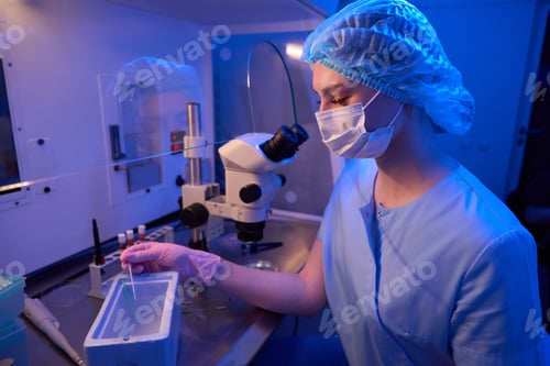 Preview: Experienced embryologist is performing cryogenic preservation of embryos in lab