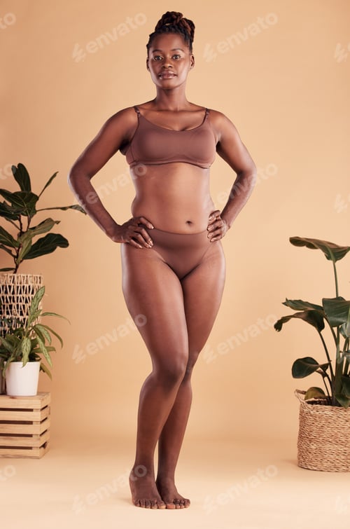 Preview: Portrait, body and beauty with a model black woman in studio on a beige background with hands on hi