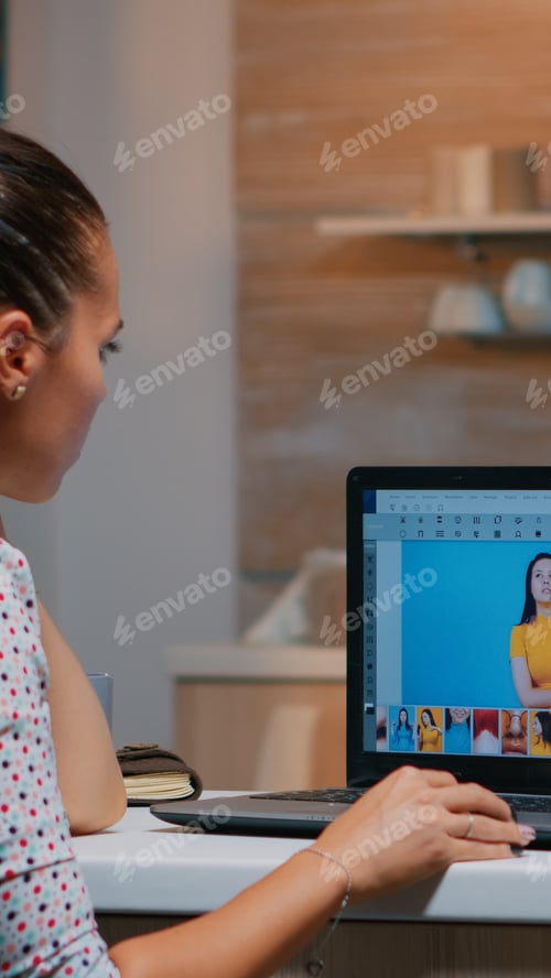 Preview: Retoucher working on laptop with photo editing software