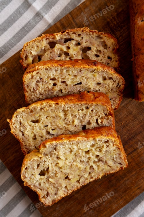 Preview: Homemade Banana Bread on a wooden board, top view. Close-up.
