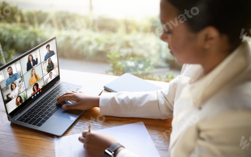 Preview: Young Woman Participating in Virtual Team Meeting at Office