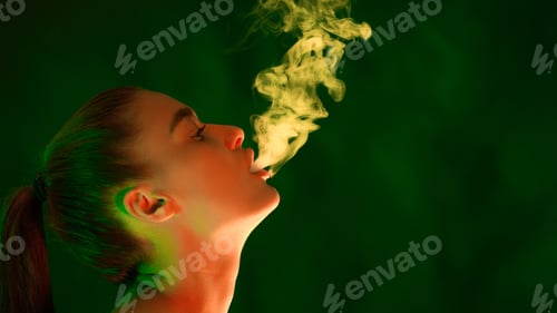 Preview: Woman Smoking Cigarette in Front of Green Background
